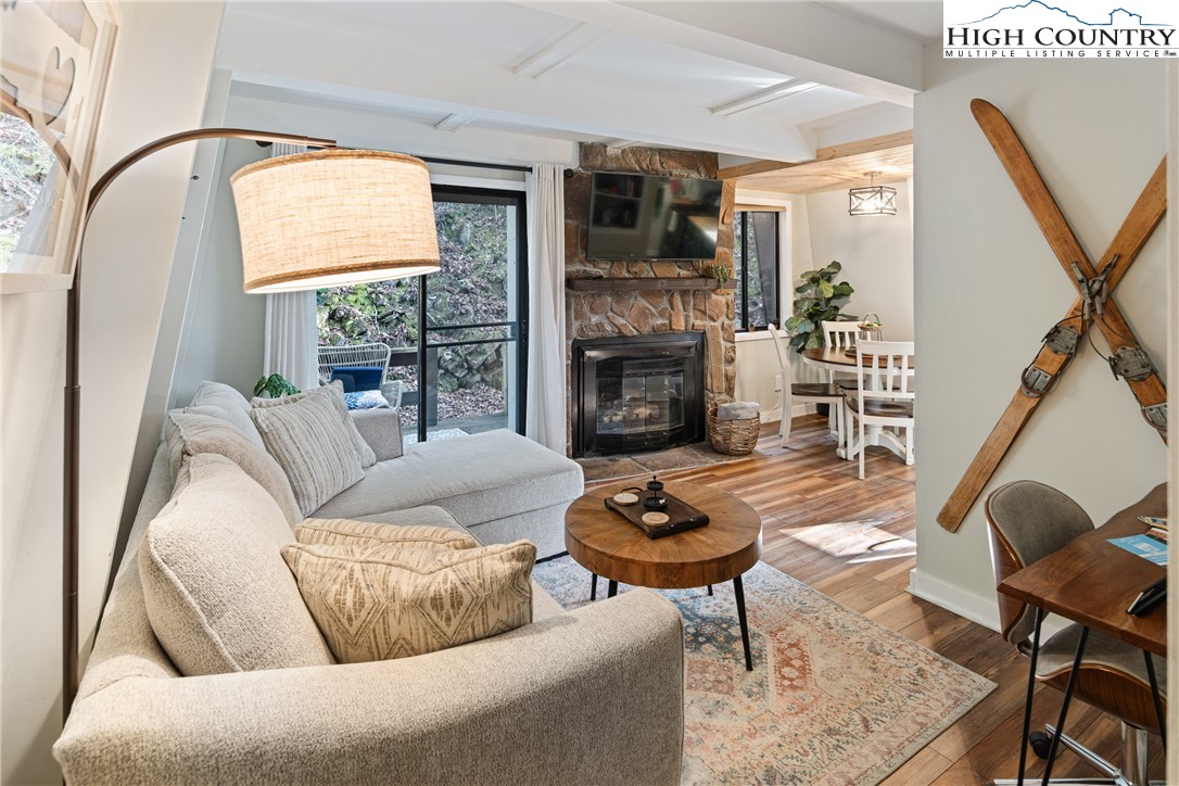 24 Creekside Court, Unit A Banner Elk, NC 28604 - Photo 1 of 24 a living room with furniture and a fireplace