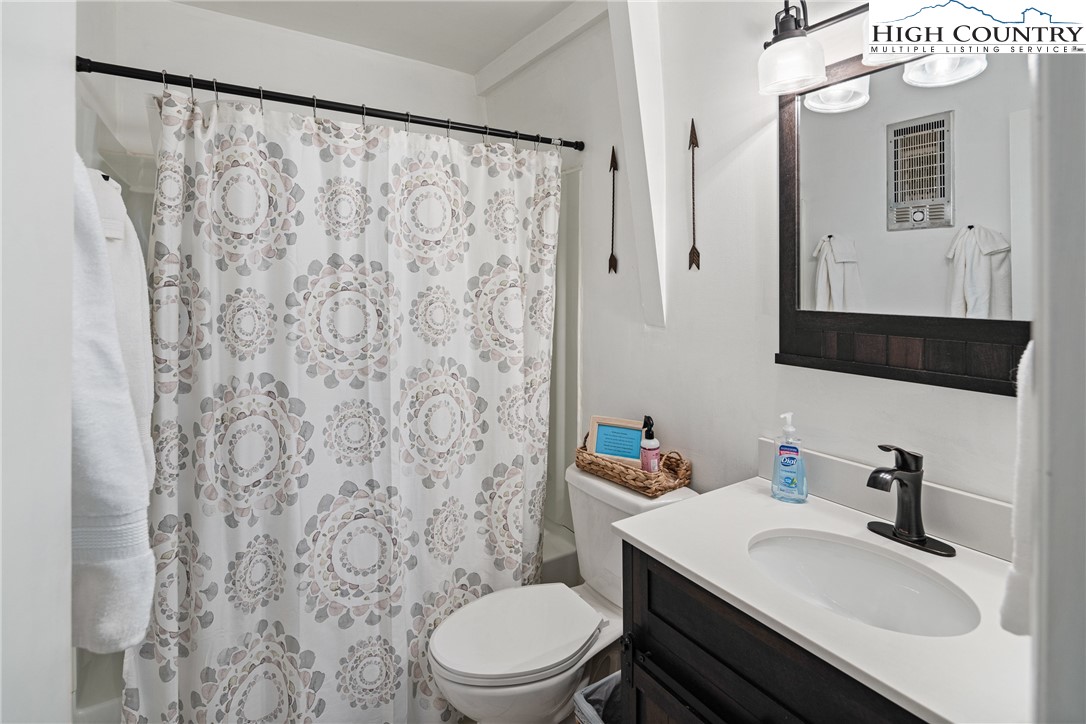 24 Creekside Court, Unit A Banner Elk, NC 28604 - Photo 14 of 24 a bathroom with a sink toilet and mirror
