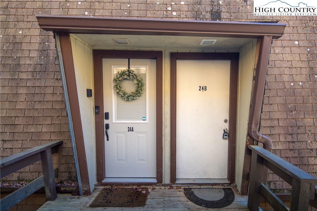 24 Creekside Court, Unit A Banner Elk, NC 28604 - Photo 20 of 24 a view of a entryway door of the house