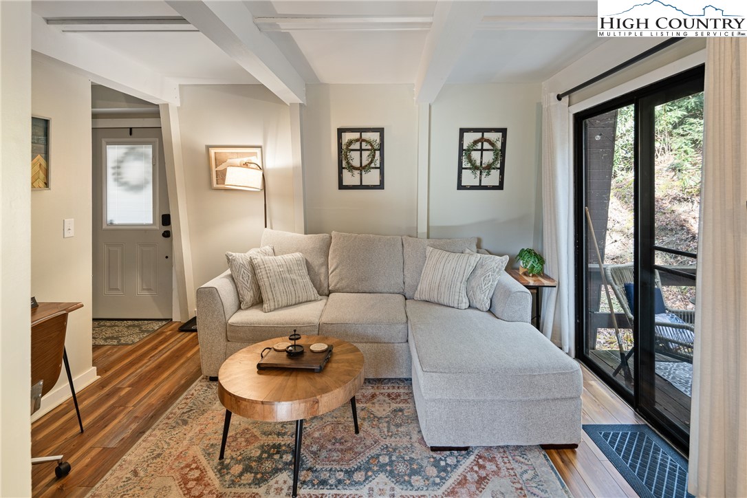 24 Creekside Court, Unit A Banner Elk, NC 28604 - Photo 4 of 24 a living room with furniture and a large window