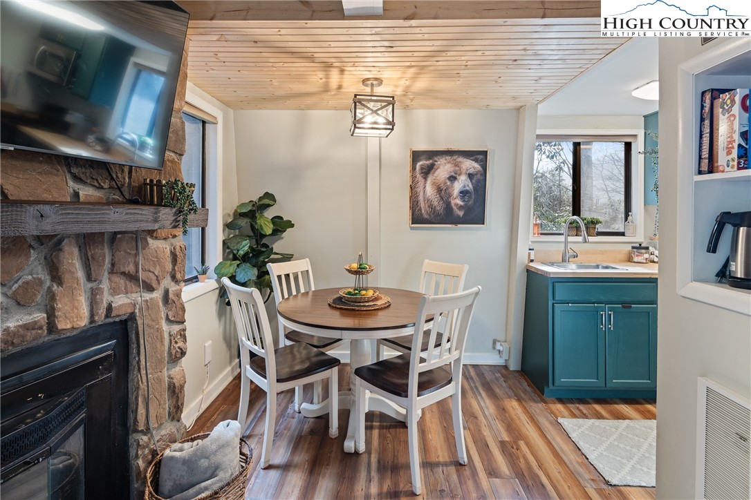 24 Creekside Court, Unit A Banner Elk, NC 28604 - Photo 5 of 24 a view of a dining room with furniture and wooden floor