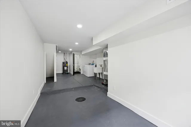 a view of a hallway with a refrigerator