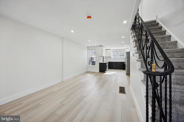 a view of kitchen with furniture and wooden floor