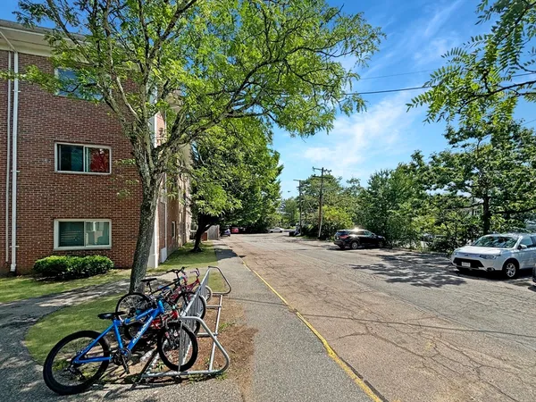 a view of a yard with cars