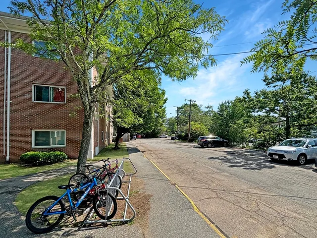 a view of a yard with cars
