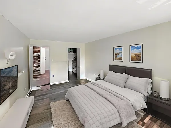 a bedroom with a large bed and a couch