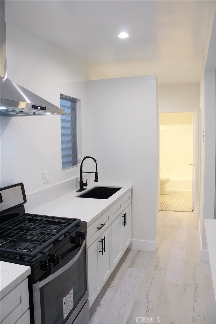 34 Ozone Avenue, Unit 2 Venice, CA 90291 - Photo 2 of 12 a kitchen with stainless steel appliances granite countertop a sink and a stove