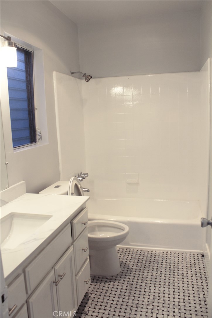 34 Ozone Avenue, Unit 2 Venice, CA 90291 - Photo 5 of 12 a bathroom with a sink a toilet and shower