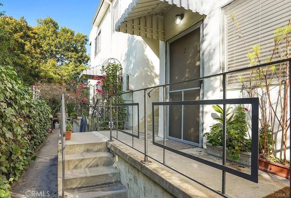 34 Ozone Avenue, Unit 2 Venice, CA 90291 - Photo 10 of 12 a view of a entrance gate of the house and trees