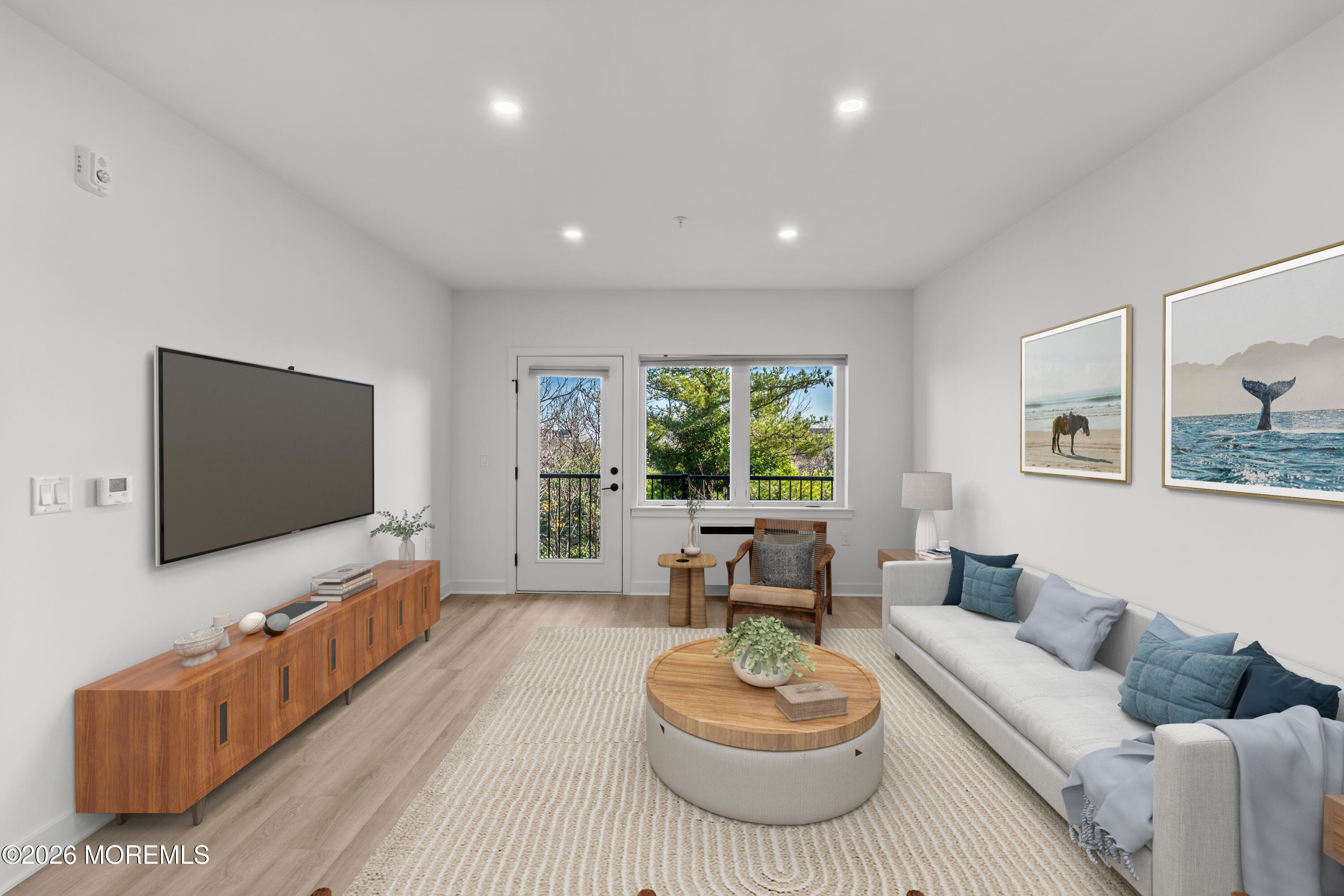 180 Morris Avenue, Unit 403 Long Branch, NJ 07740 - Photo 2 of 15 a living room with furniture and a flat screen tv