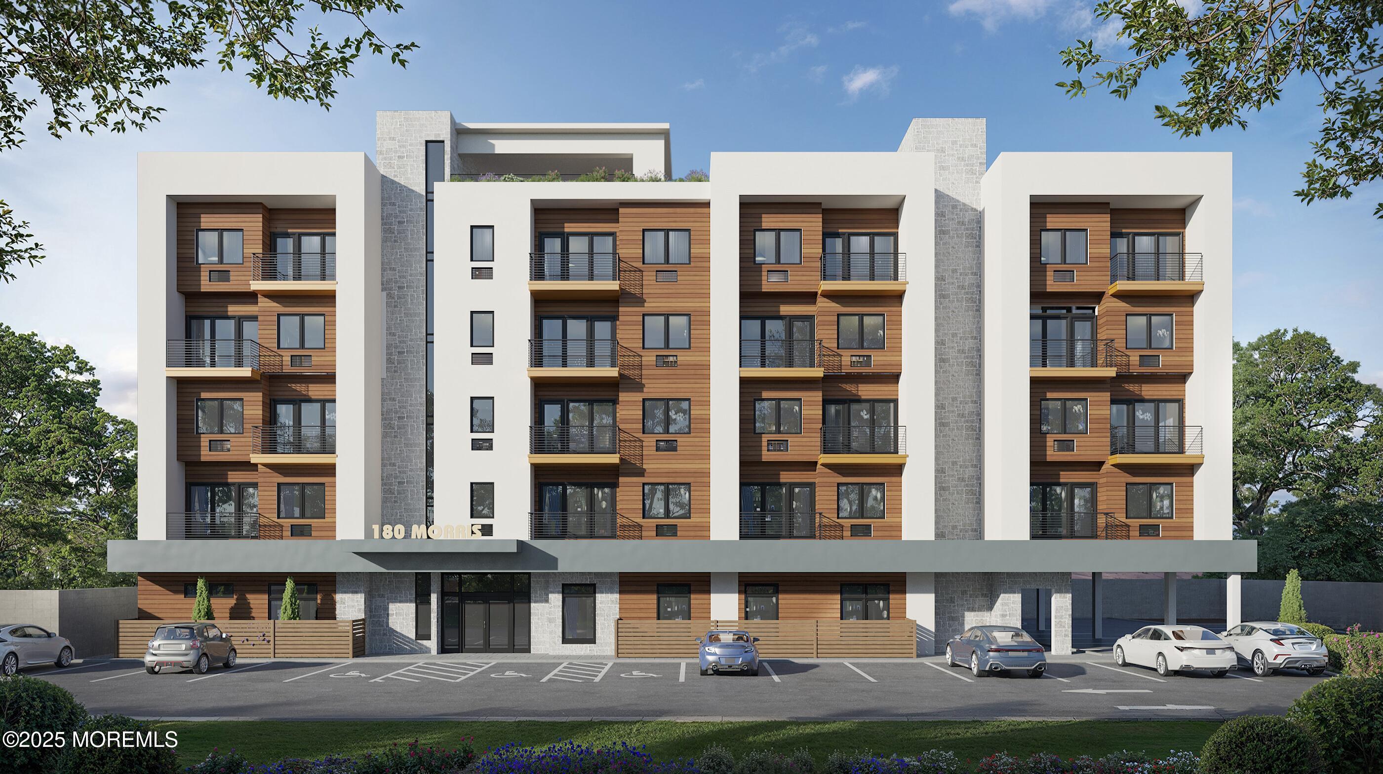 180 Morris Avenue, Unit 403 Long Branch, NJ 07740 - Photo 6 of 6 a front view of a building with many windows and yard