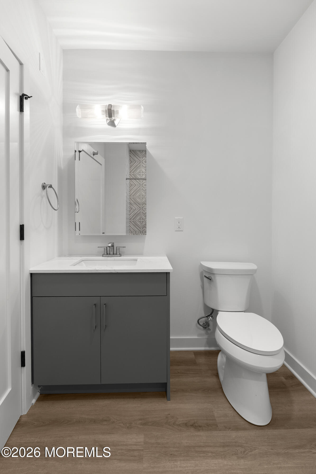 180 Morris Avenue, Unit 403 Long Branch, NJ 07740 - Photo 7 of 15 a bathroom with a sink vanity and a toilet