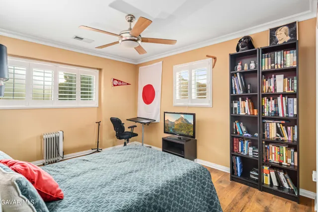 an aerial view of a house with a mountain