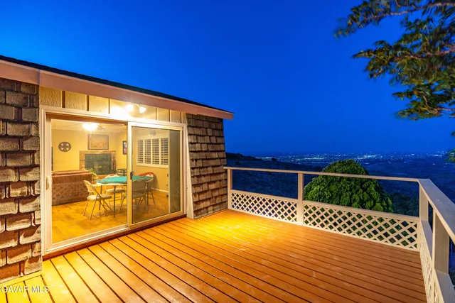 a couple of potted plants in front of door
