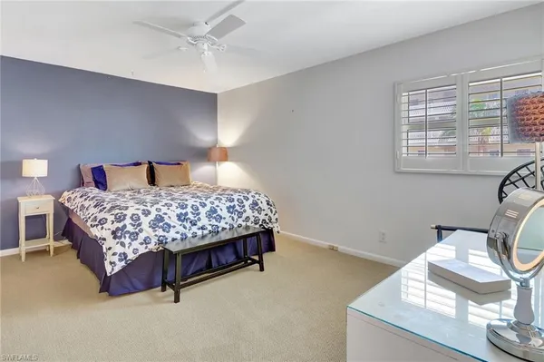 a bedroom with a bed and a curtain