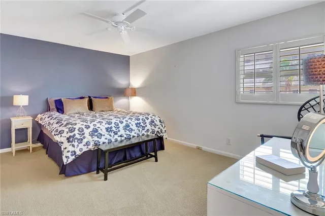 a bedroom with a bed and a curtain