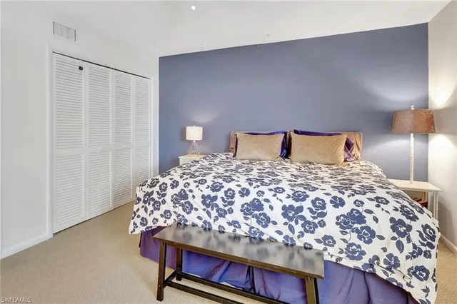 a bedroom with a bed and furniture