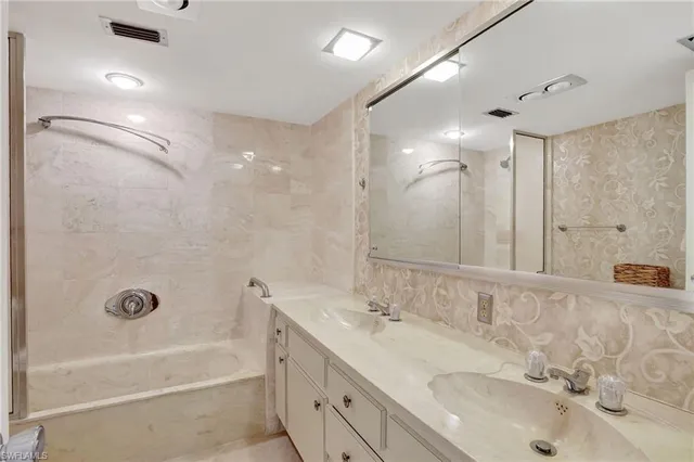 a bathroom with a sink and a shower
