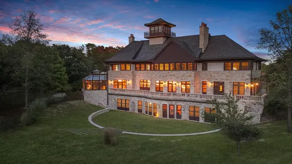 a bed room with a bed and a chair