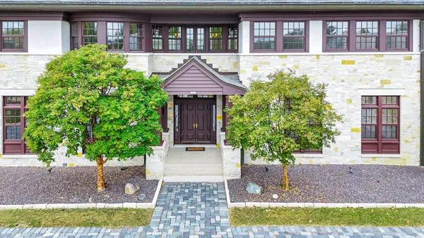 a view of livingroom with furniture wooden floor and a floor to ceiling window
