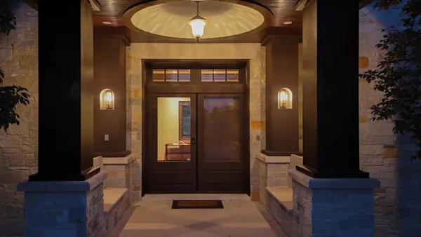 a view of a living room and entryway with wooden floor