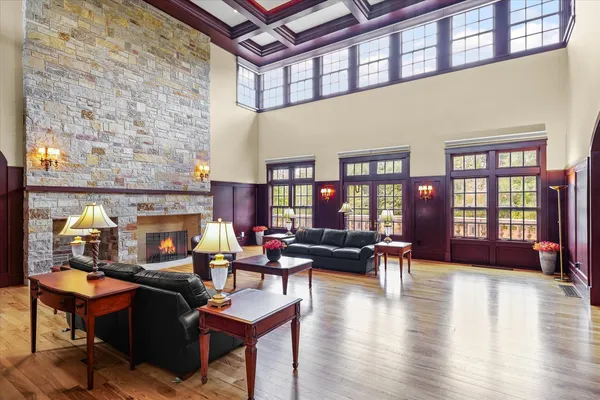 a bathroom with a granite countertop toilet a sink and a shower