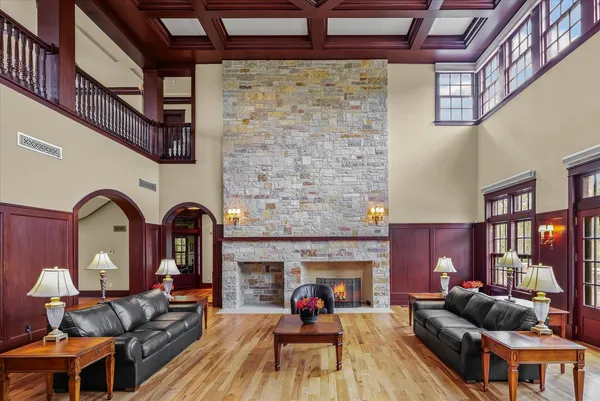 a bedroom with a large bed and a dresser next to a window