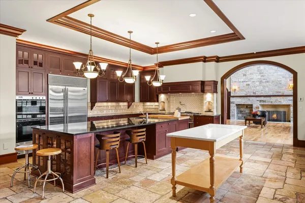 a living room with furniture gym equipment and a large window