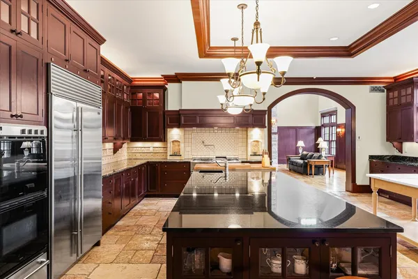 a bed room with furniture and a flat screen tv