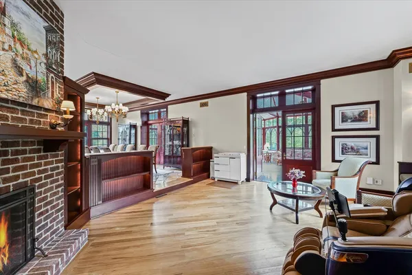an aerial view of multiple houses with a yard and lake view