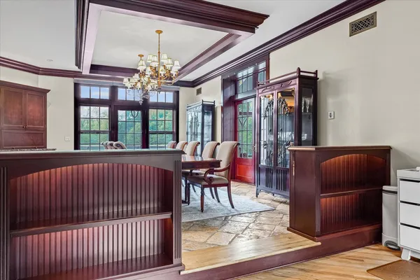 an aerial view of a house with a garden and lake view