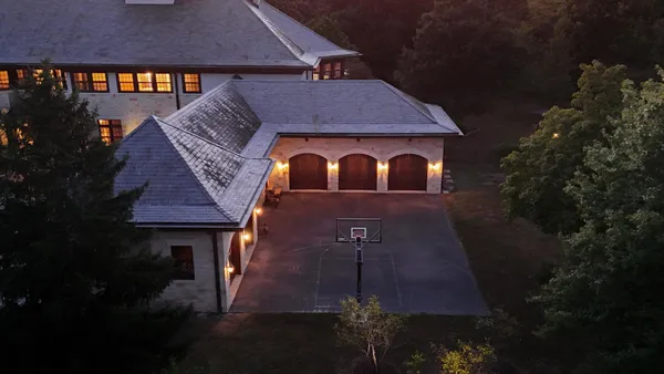 a living room with furniture and large window