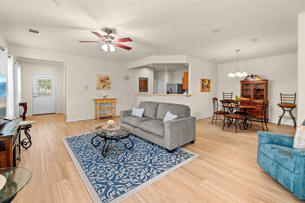 109 Providence Street Georgetown, TX 78633 - Photo 11 of 31 a living room with furniture and wooden floor