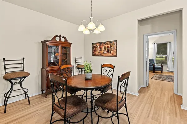a kitchen with granite countertop a sink stainless steel appliances and cabinets