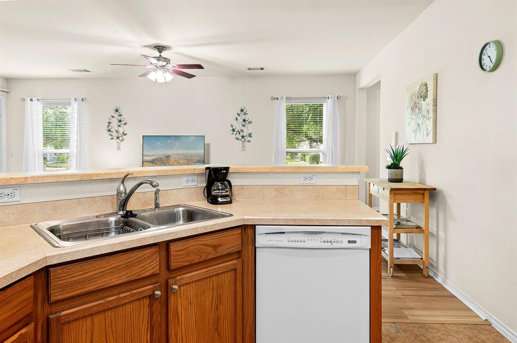 109 Providence Street Georgetown, TX 78633 - Photo 15 of 31 a kitchen with a sink cabinets and window
