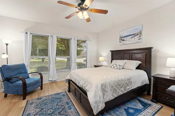 a view of a hallway with stairs and a closet
