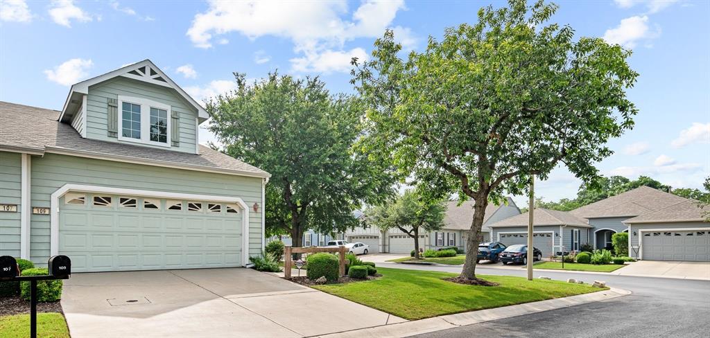 109 Providence Street Georgetown, TX 78633 - Photo 2 of 31 a front view of a building with garden