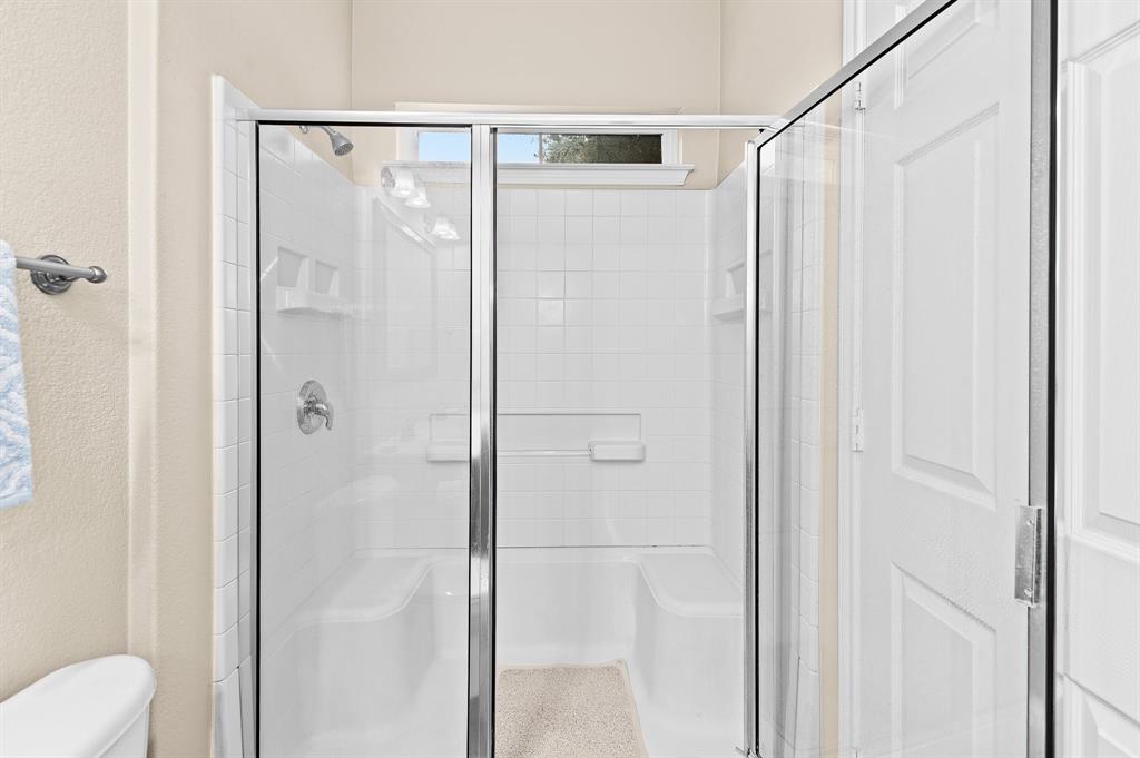 109 Providence Street Georgetown, TX 78633 - Photo 22 of 31 a bathroom with a shower and a toilet