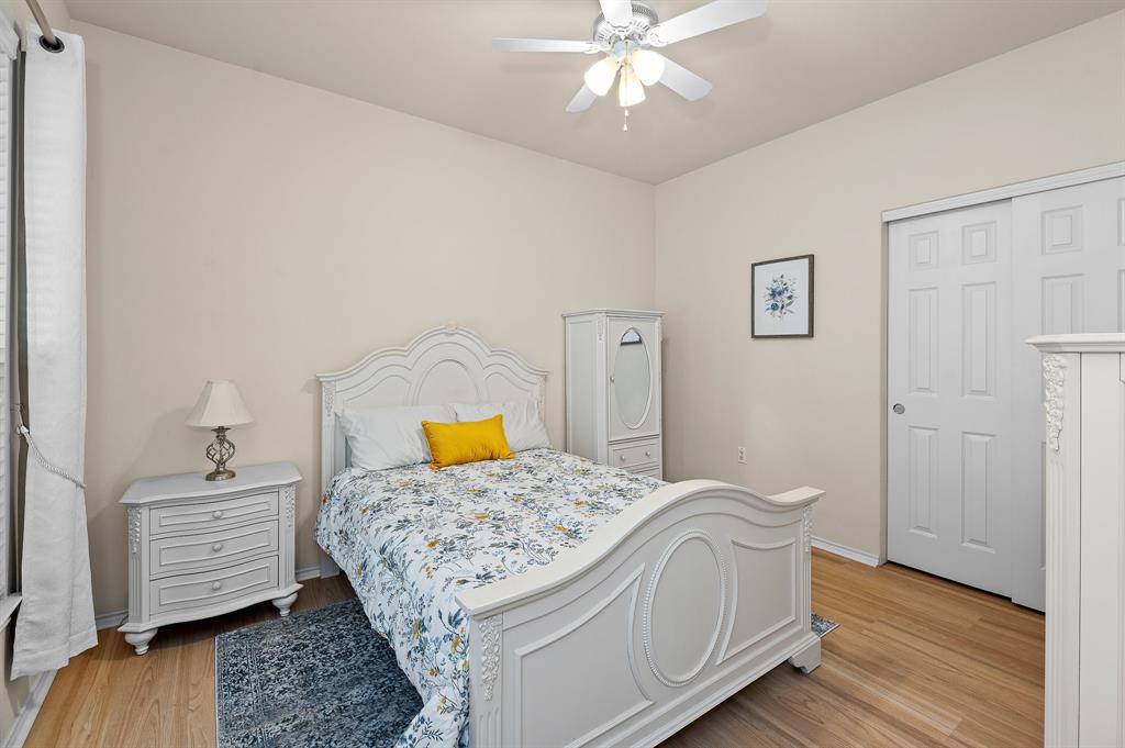 109 Providence Street Georgetown, TX 78633 - Photo 24 of 31 a bedroom with a bed and wooden floor