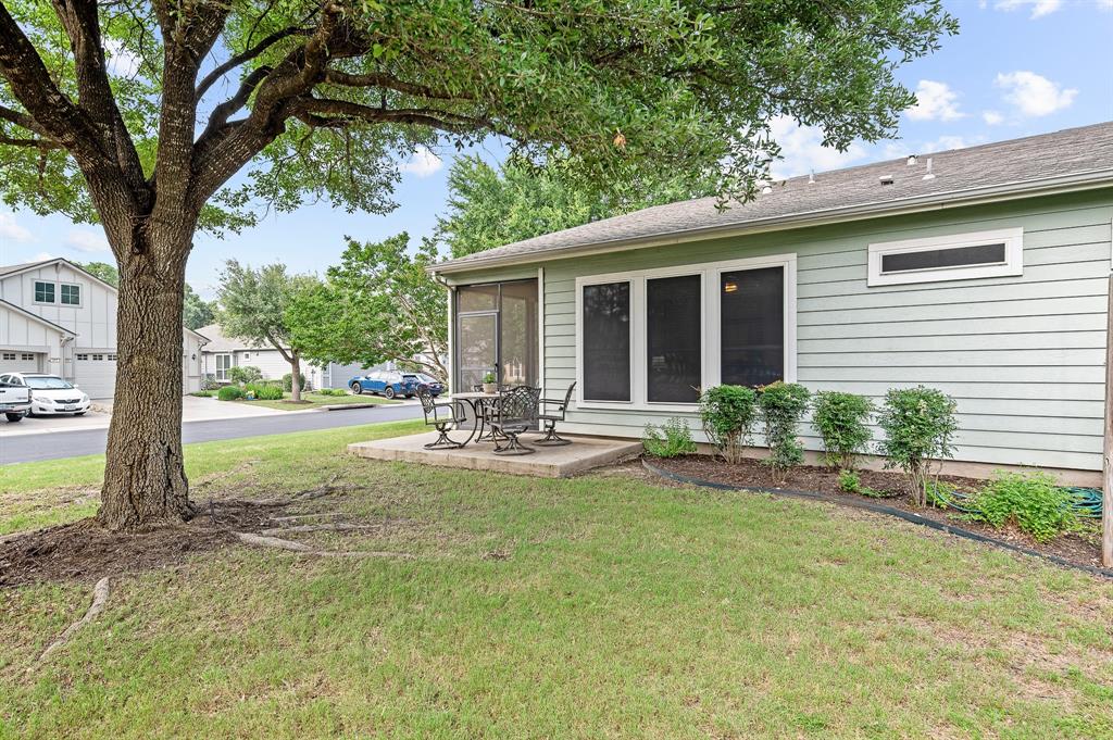 109 Providence Street Georgetown, TX 78633 - Photo 29 of 31 a view of a house with backyard and sitting area