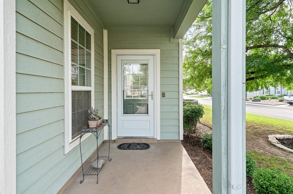109 Providence Street Georgetown, TX 78633 - Photo 4 of 31 a view of a balcony with chair and floor to ceiling window