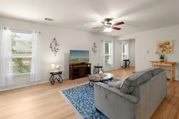 a living room with furniture and a fireplace