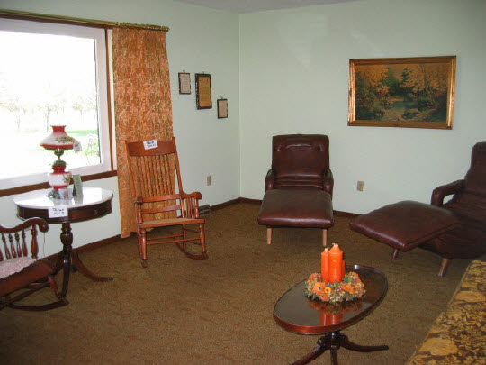 9668 Cunningham Road Winnebago, IL 61088 - Photo 4 of 6 a living room with furniture and wooden floor