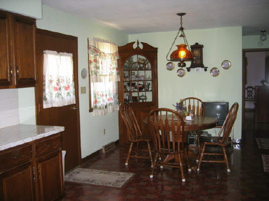 9668 Cunningham Road Winnebago, IL 61088 - Photo 5 of 6 a view of a dining room that has a table and chairs in it