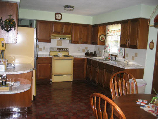 9668 Cunningham Road Winnebago, IL 61088 - Photo 6 of 6 a kitchen with sink a stove and cabinets