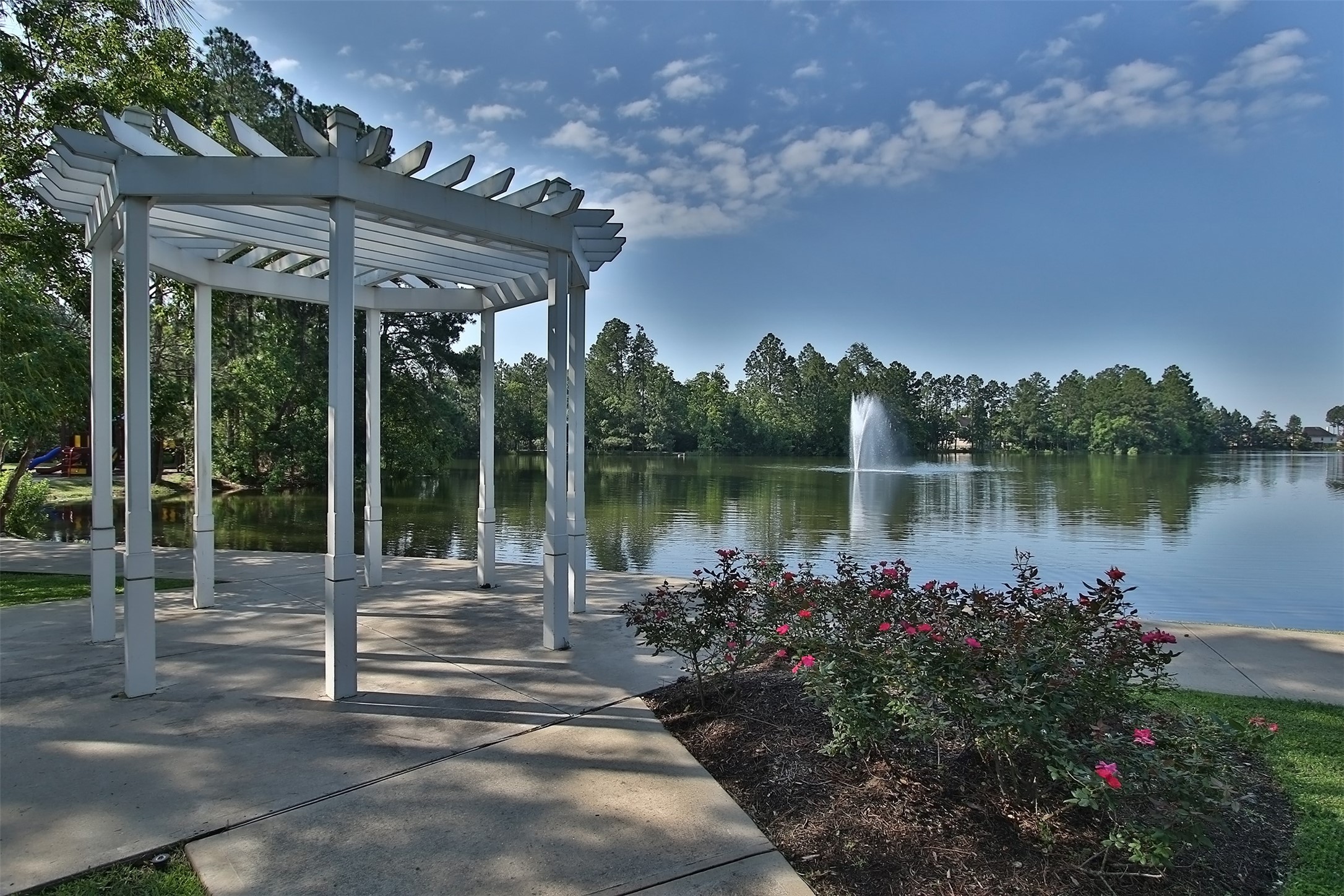 20410 Misty Crossing Lane Spring, TX 77379 - Photo 44 of 50 Lovely gazebo-type pergola on the edge of the lovely lake. Great place to relax. Beautiful Windrose.