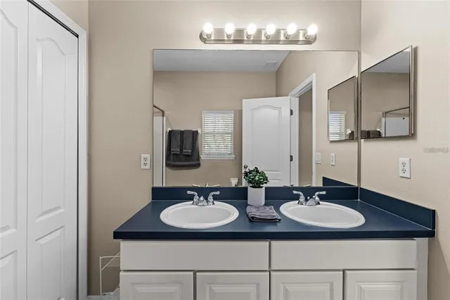 a bathroom with a shower and a glass door