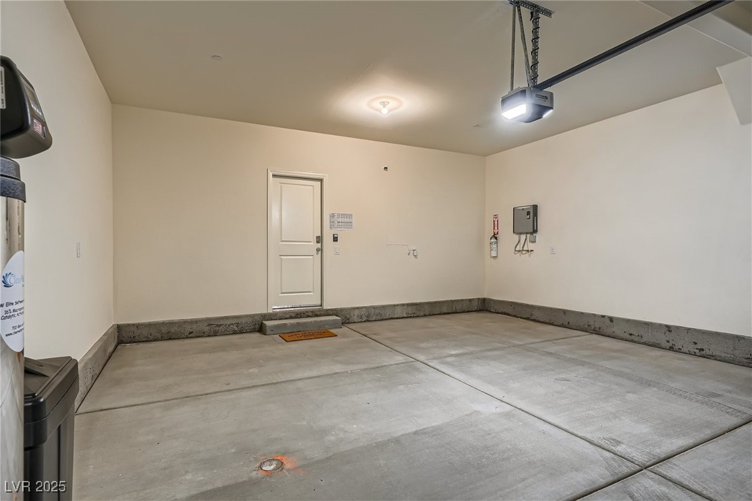 527 Clearsable Avenue Henderson, NV 89044 - Photo 9 of 11 Garage featuring a garage door opener