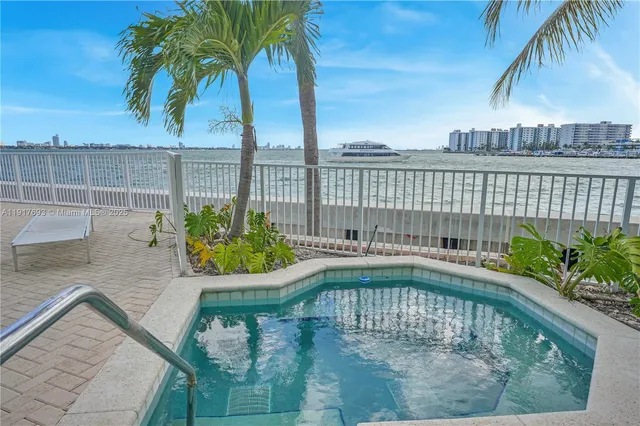 a view of parking garage with cars parked
