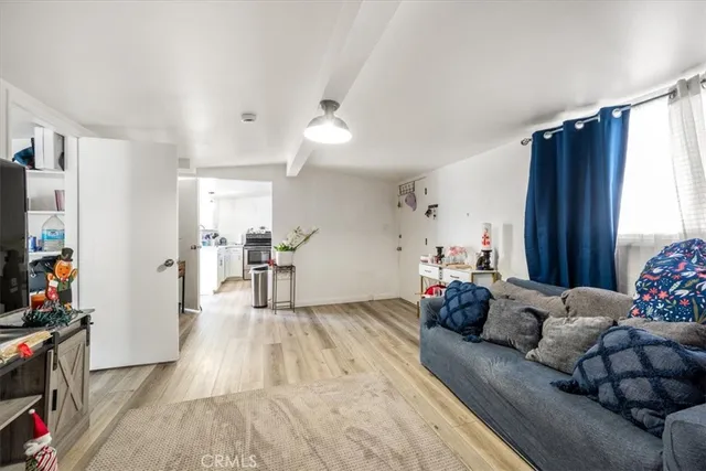 a very nice looking room with a wooden floor and white walls